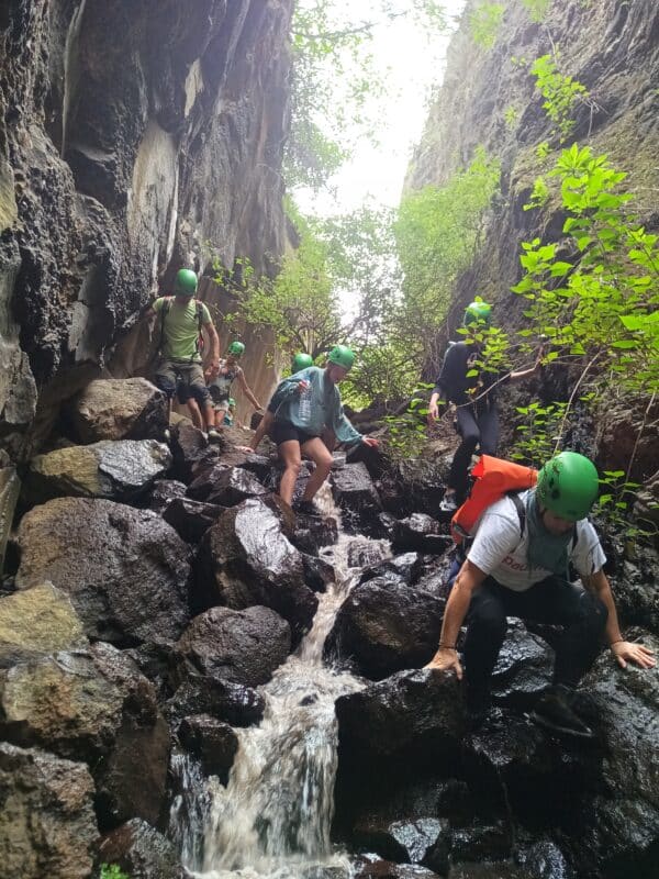 People walking on rocks.