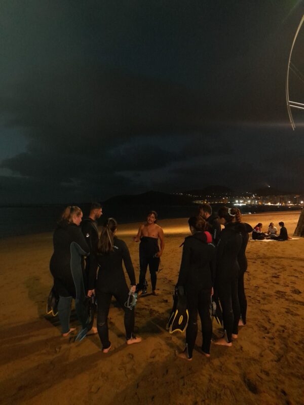 People getting ready for night snorkelling.