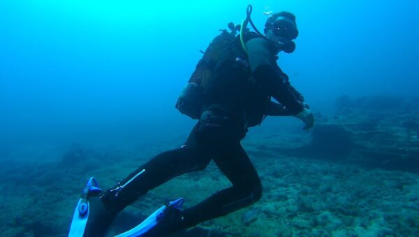 Man scuba diving.