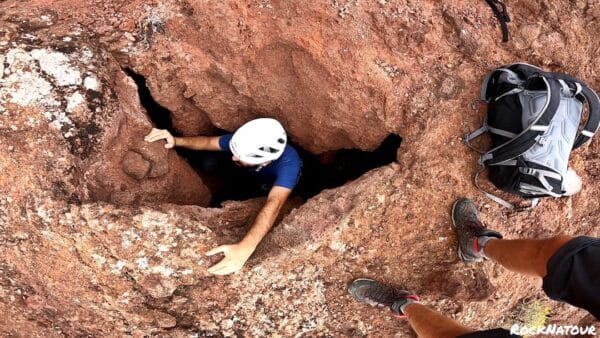 Person climbing in a small space.