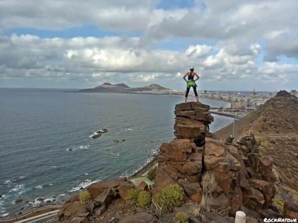 Person on top of a rock.