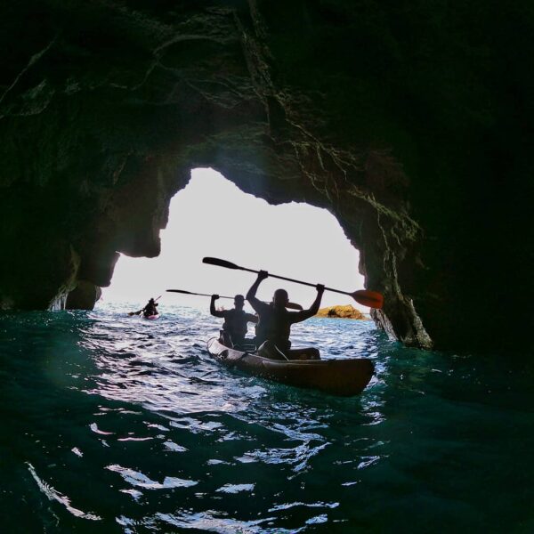 Kayak entering a cave.