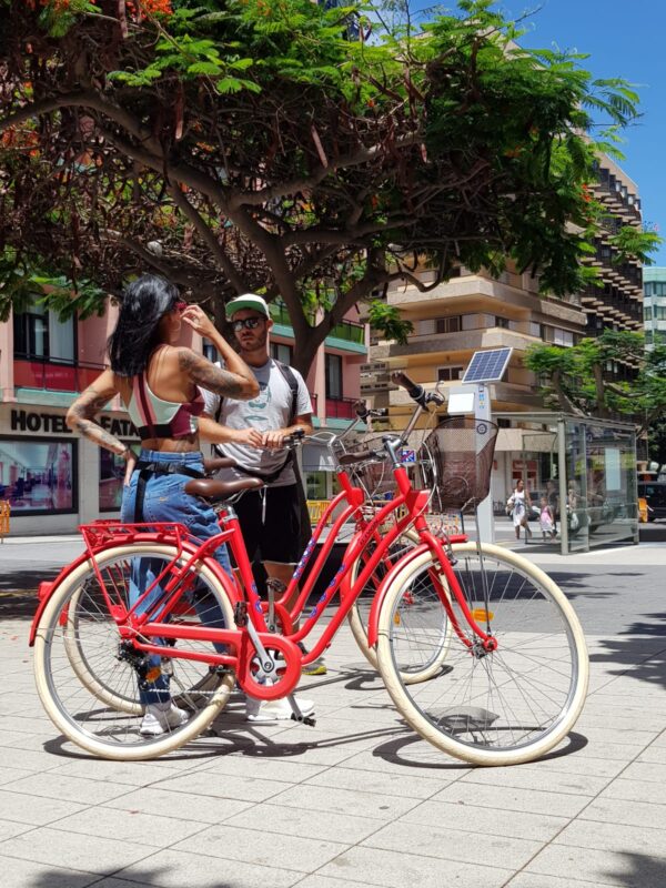 Two people with bikes.