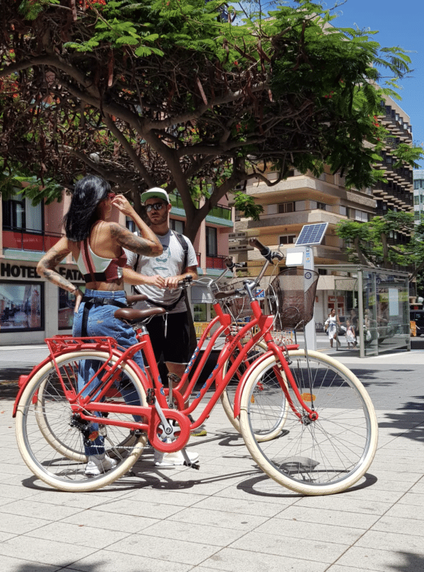 Two people with bikes.