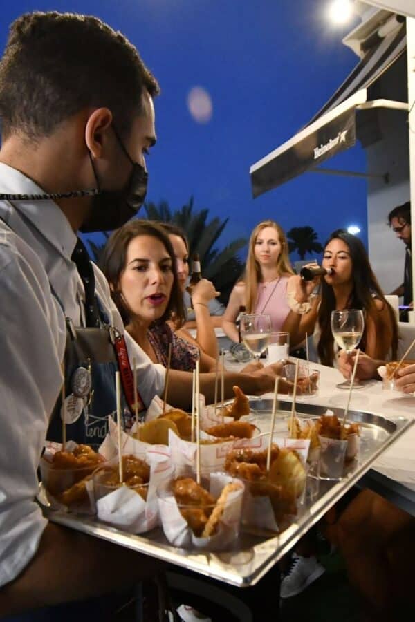 People at a table with food.