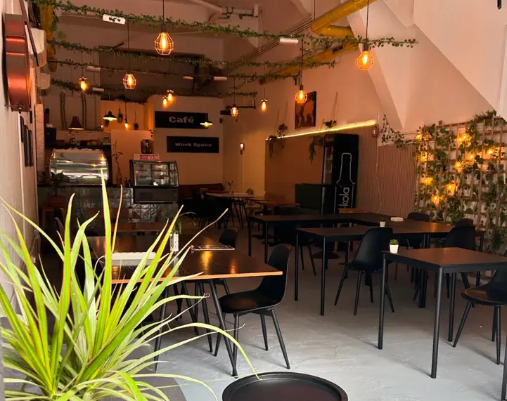 A vibrant café in Gran Canaria, Spain, showcasing a lively bar area and inviting ambiance for visitors.